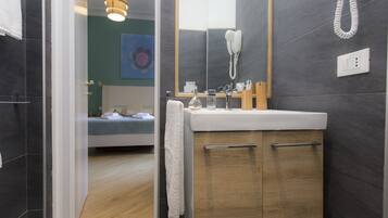 Shower, free toiletries, hair dryer, towels