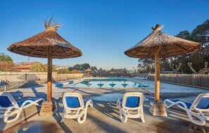 A swimming pool with lounge chairs and thatched umbrellas. - St Jean Luz Hotel Erromardie Suite 4p (Saint-Jean-de-Luz)