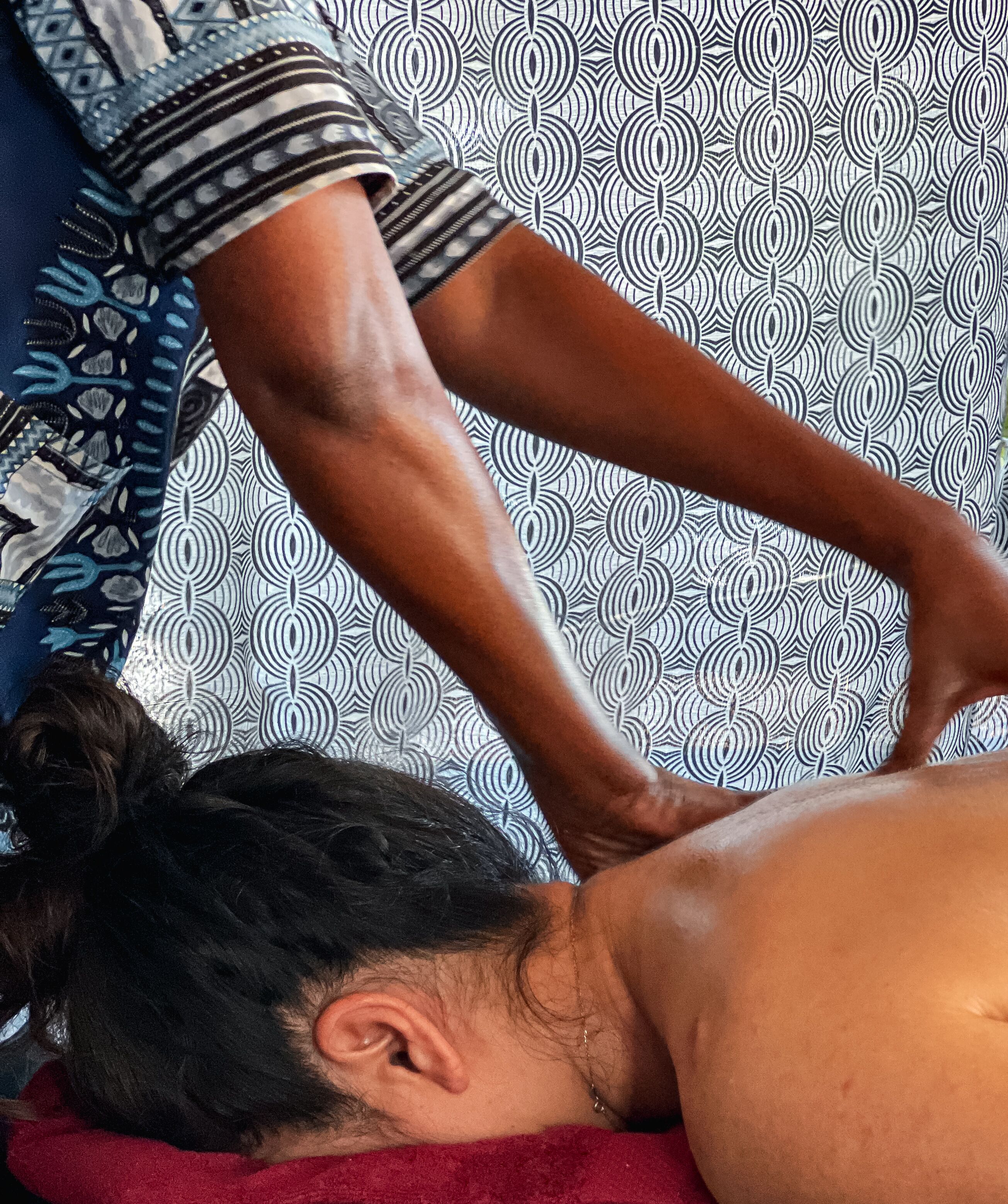 A person receiving a back massage.