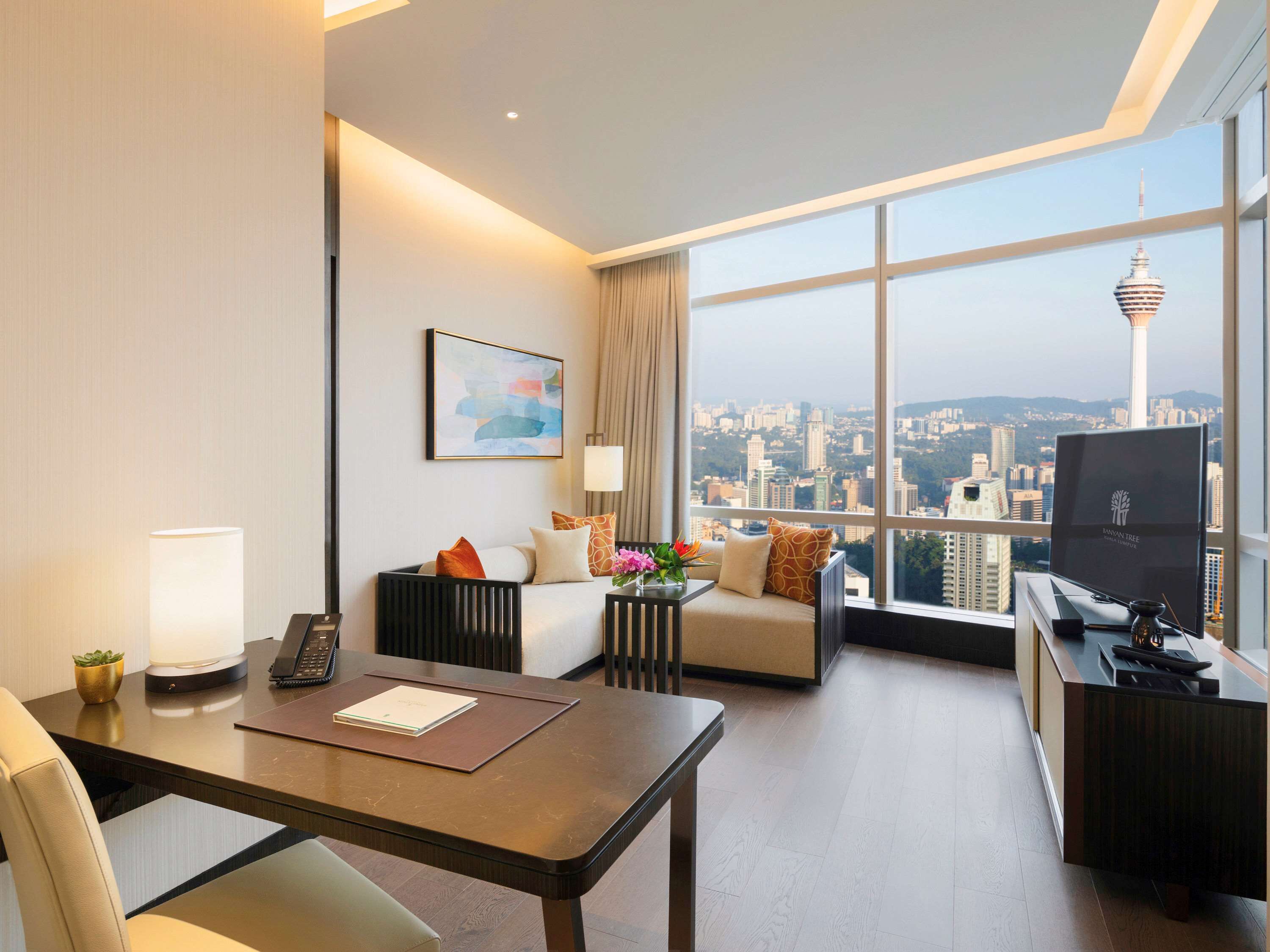 sky suite, 1 king bed, twin tower view or city skyline view | minibar, in-room safe, desk, laptop workspace