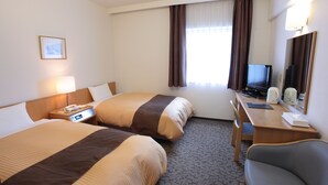 A hotel room with two beds, a desk with a computer, a chair, and a television. - Hotel Castle Plaza (Akashi)