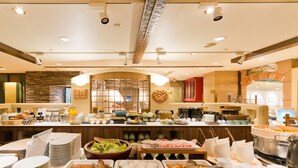 A buffet setup with various food items and utensils. - Hotel Castle Plaza (Akashi)