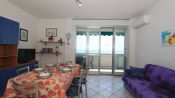 Classic Apartment | Living area | 32-inch flat-screen TV with satellite channels, TV