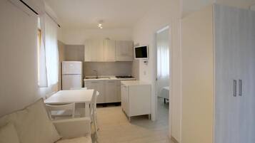 Fridge, stovetop, cookware/dishes/utensils