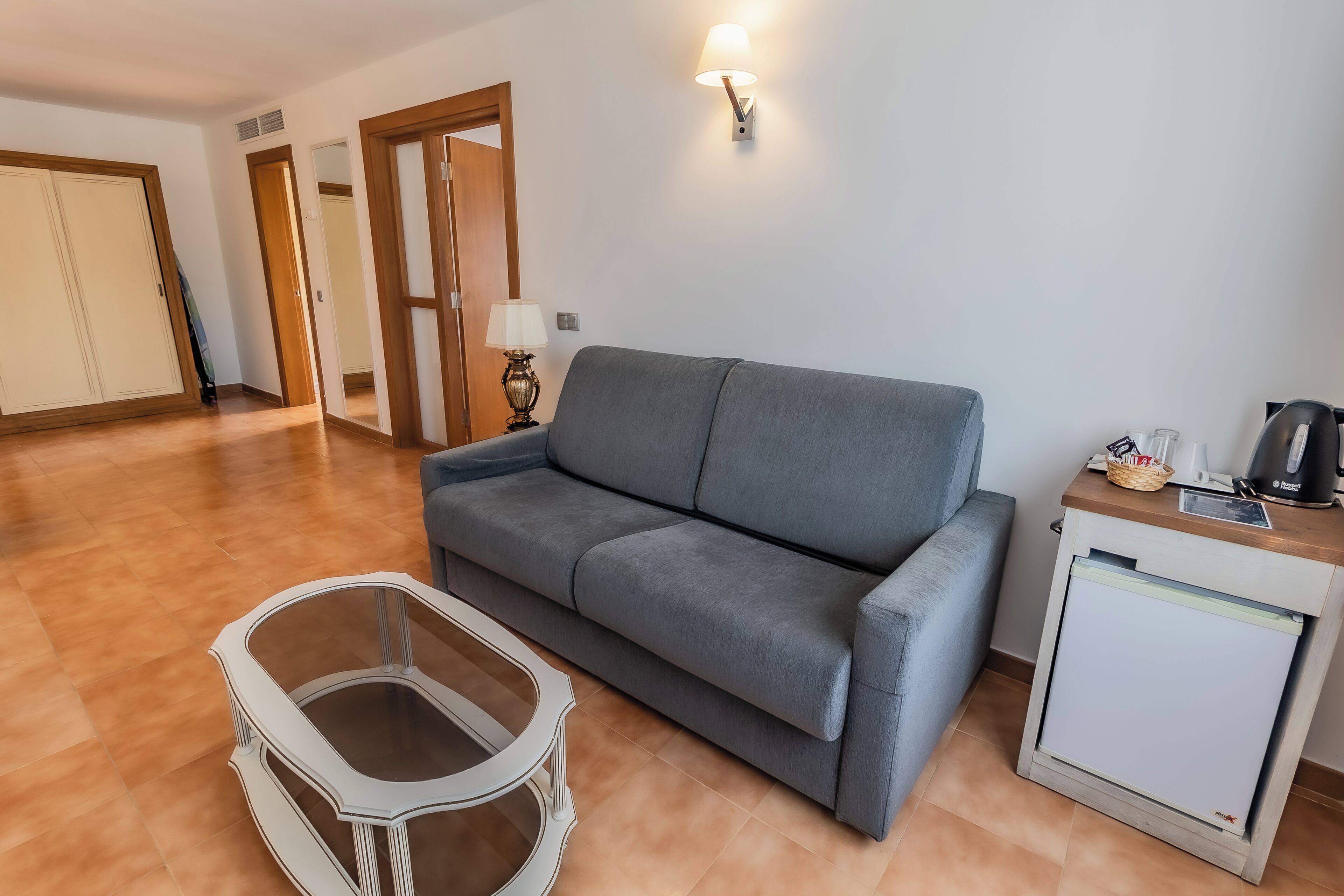 family room | 1 bedroom, minibar, in-room safe, desk