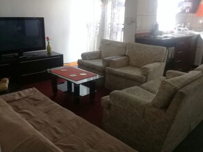 Apartment, 2 Bedrooms | Living room | Flat-screen TV