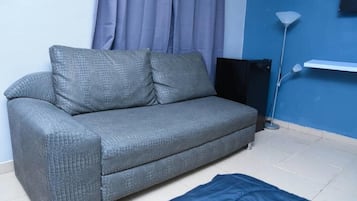 Executive Apartment | Living area | Flat-screen TV