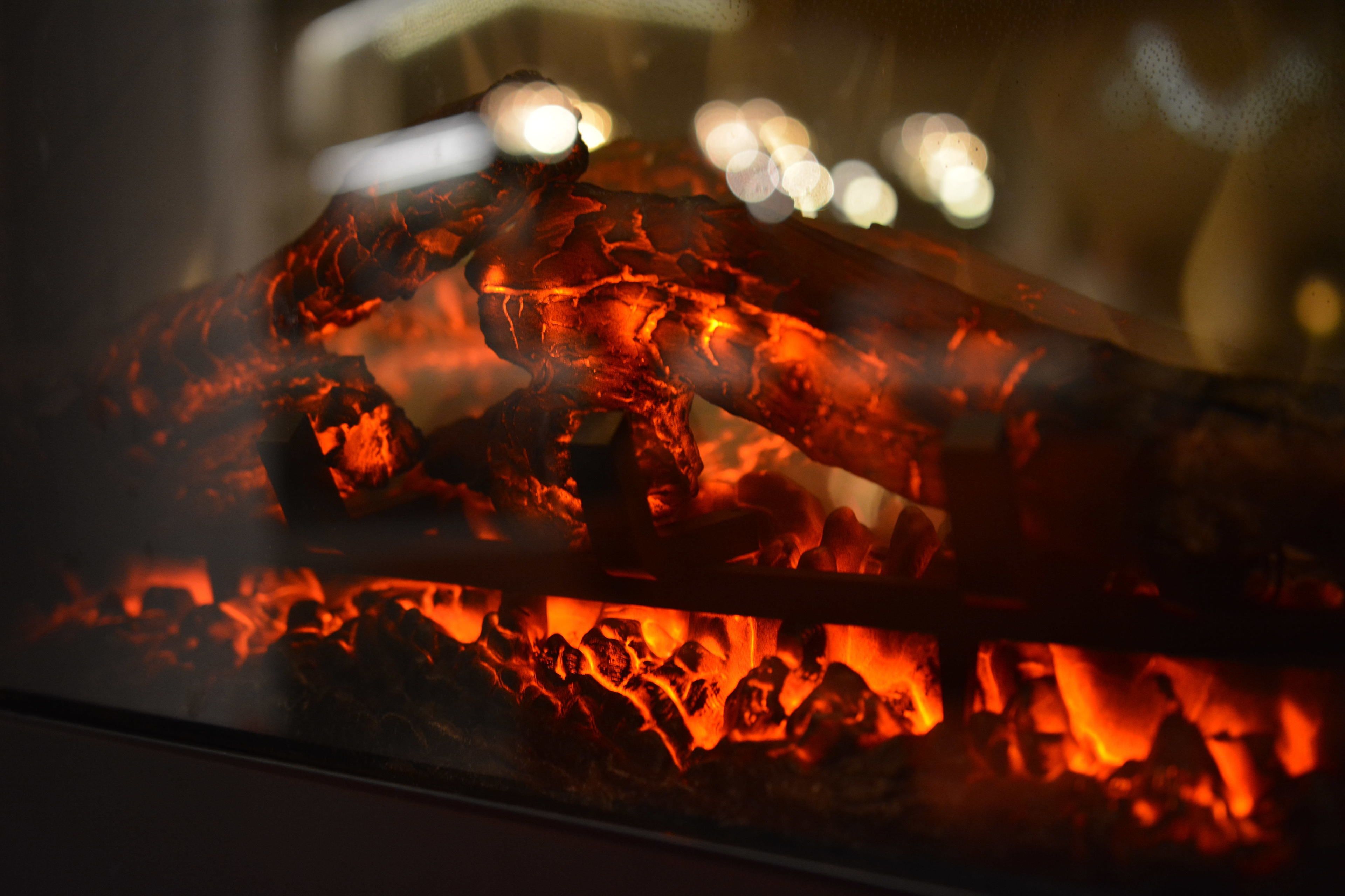 A close-up of glowing charcoal coals.