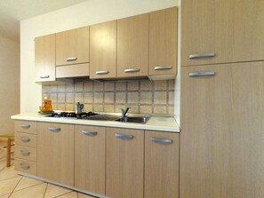 Apartment, 2 Bedrooms | Private kitchen | Full-size fridge, stovetop, cookware/dishes/utensils - Mare Pineta Apartments (Comacchio)