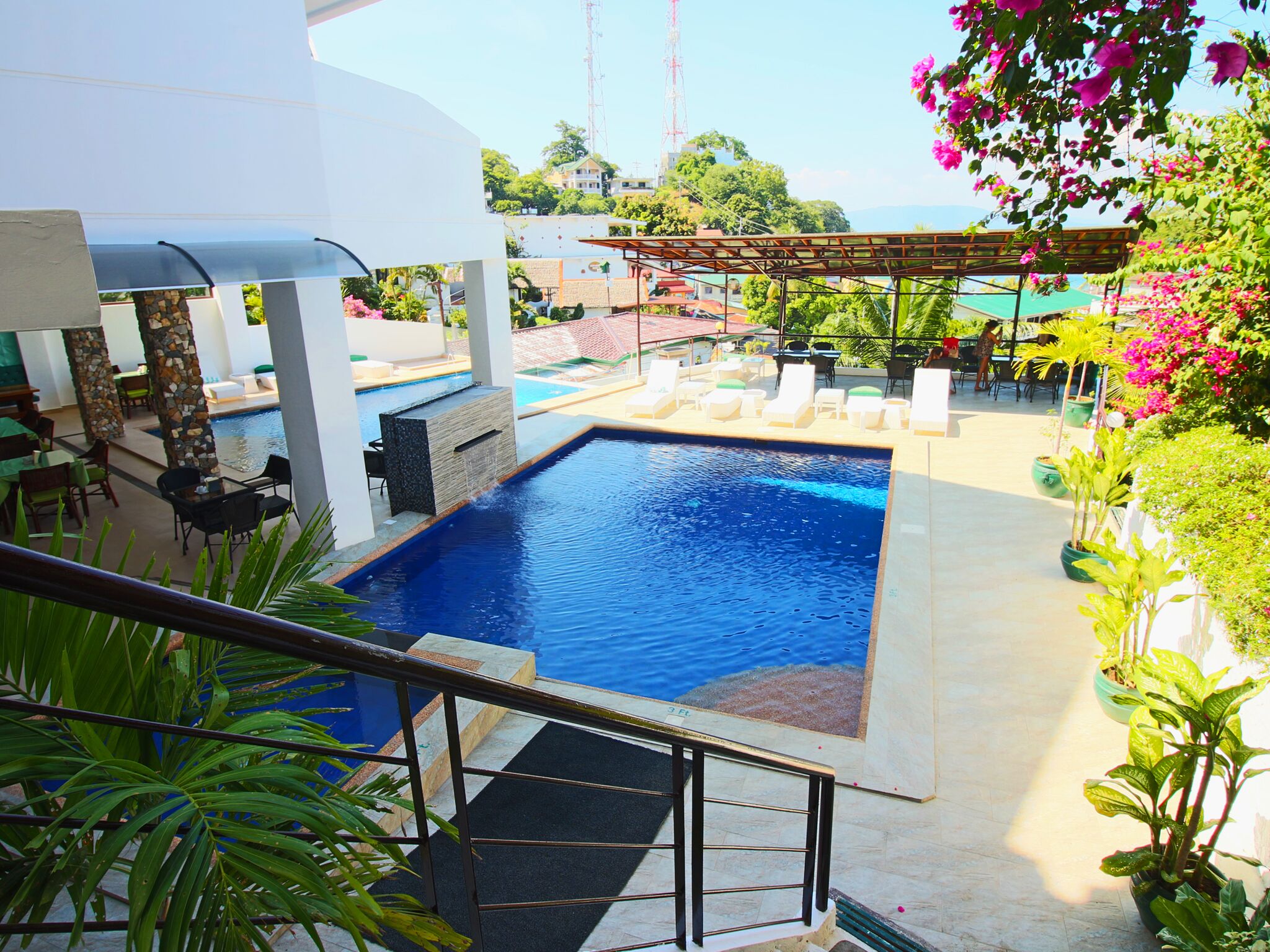 2 outdoor pools, open 8 AM to 10 PM, pool umbrellas, pool loungers