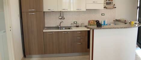 Villa, 2 Bedrooms | Private kitchen | Full-size fridge, microwave, stovetop, coffee/tea maker
