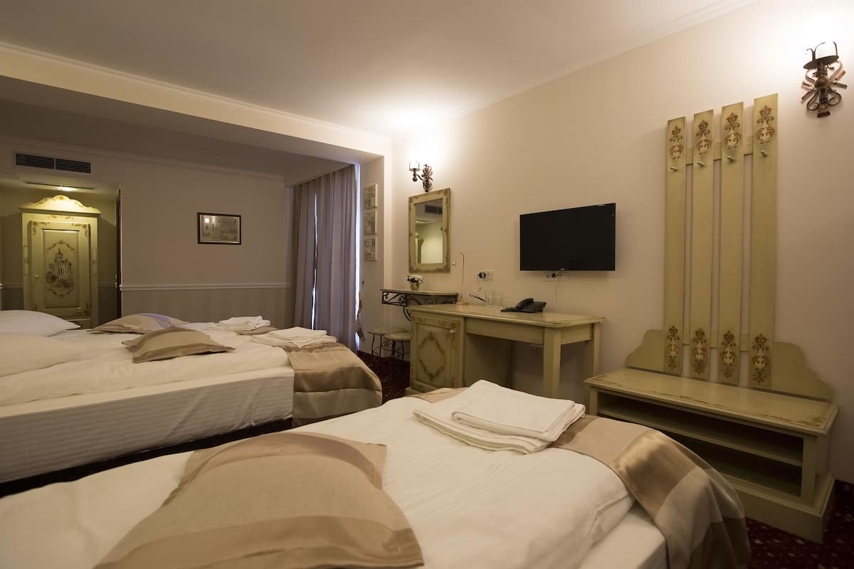 deluxe triple room | premium bedding, minibar, in-room safe, desk