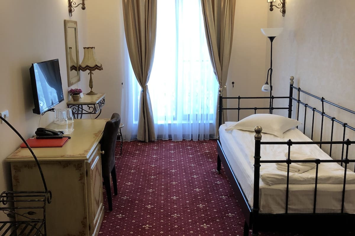 family suite, 1 king bed with sofa bed, accessible, courtyard view | premium bedding, minibar, in-room safe, desk