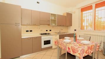 Classic Apartment, 2 Bedrooms | Private kitchen | Full-size fridge, oven, stovetop, cookware/dishes/utensils