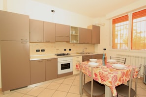 Classic Apartment, 2 Bedrooms | Private kitchen | Full-sized fridge, oven, stovetop, cookware/dishes/utensils