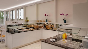 A modern breakfast buffet with various food items, a glass display case, and decorative plants. - Seereich Hotel & Pension (Lindau)