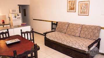 Apartment, 1 Bedroom | Living area | 32-inch flat-screen TV with cable channels, TV