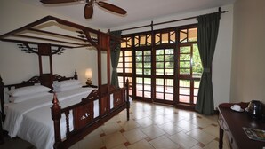 A traditional bedroom with a four-poster bed, a ceiling fan, and a large window with curtains. - Hunters Lodge - Kiboko (Kiboko)