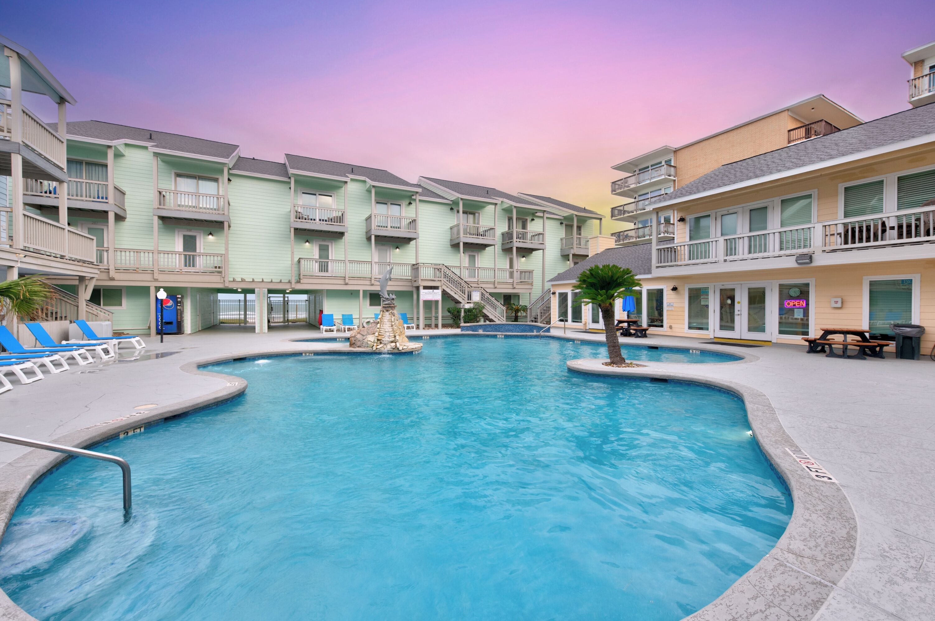 A heated pool, sun loungers