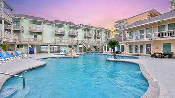 A heated pool, sun loungers