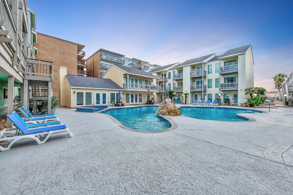 A heated pool, pool loungers