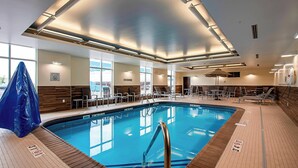 An indoor swimming pool with clear markings, a lifeguard chair, and a covered area. - Fairfield Inn & Suites by Marriott Duluth Waterfront (Duluth)
