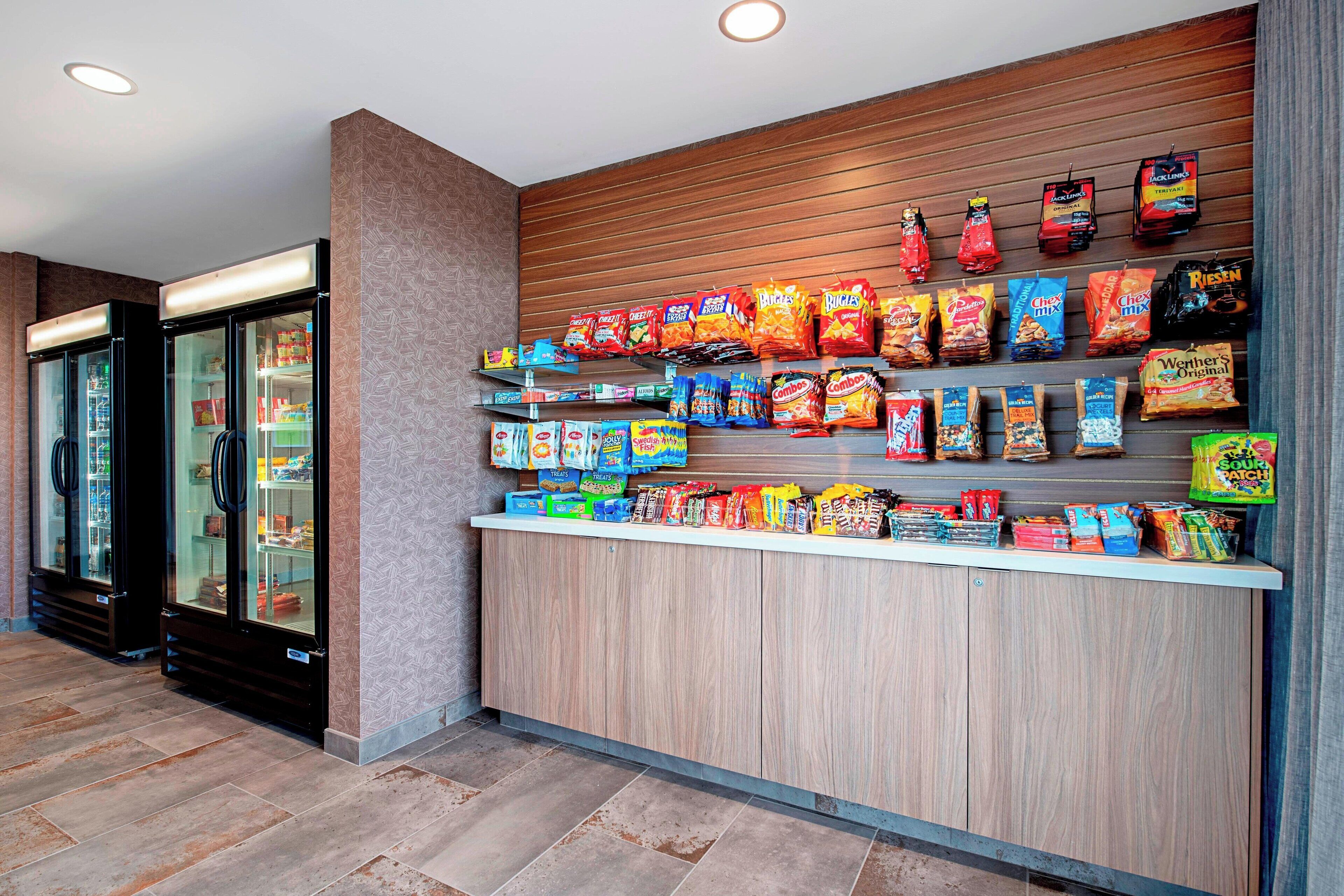 A snack bar with various packaged snacks and beverages.