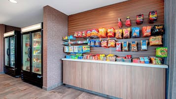 A snack bar with various packaged snacks and beverages.