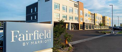 A multi-story hotel with a sign reading "Fairfield by Marriott."