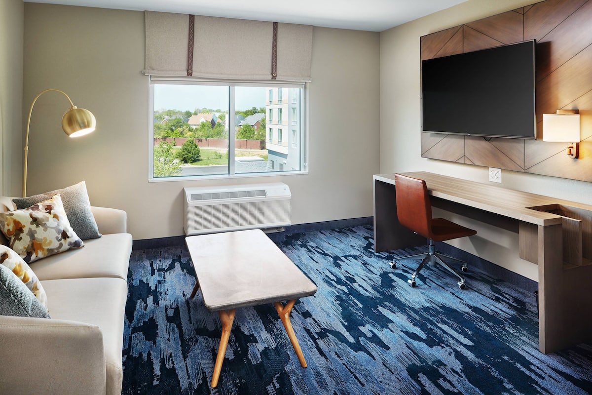 Suite, 1 King Bed with Sofa bed | Living area | 55-inch Smart TV with satellite channels, TV, Netflix