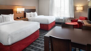 A hotel room with two beds, a desk, a chair, a TV, and a window with curtains. - TownePlace Suites by Marriott Louisville Northeast (Louisville)
