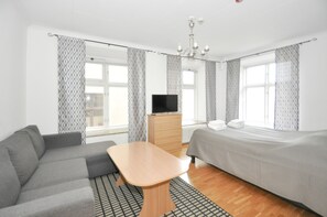 Double Room (Lower Ground Floor with Sofa Bed) | Living area | Flat-screen TV - Boende Visby (Visby)