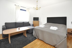Double Room (With Sofa Bed) | Living area | Flat-screen TV