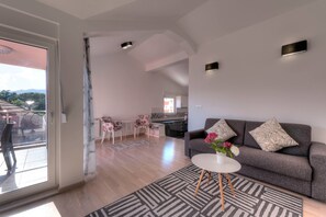 Deluxe Apartment, 1 Bedroom, Sea View | Living area | Flat-screen TV, fireplace - Apartments Delfin (Tivat)