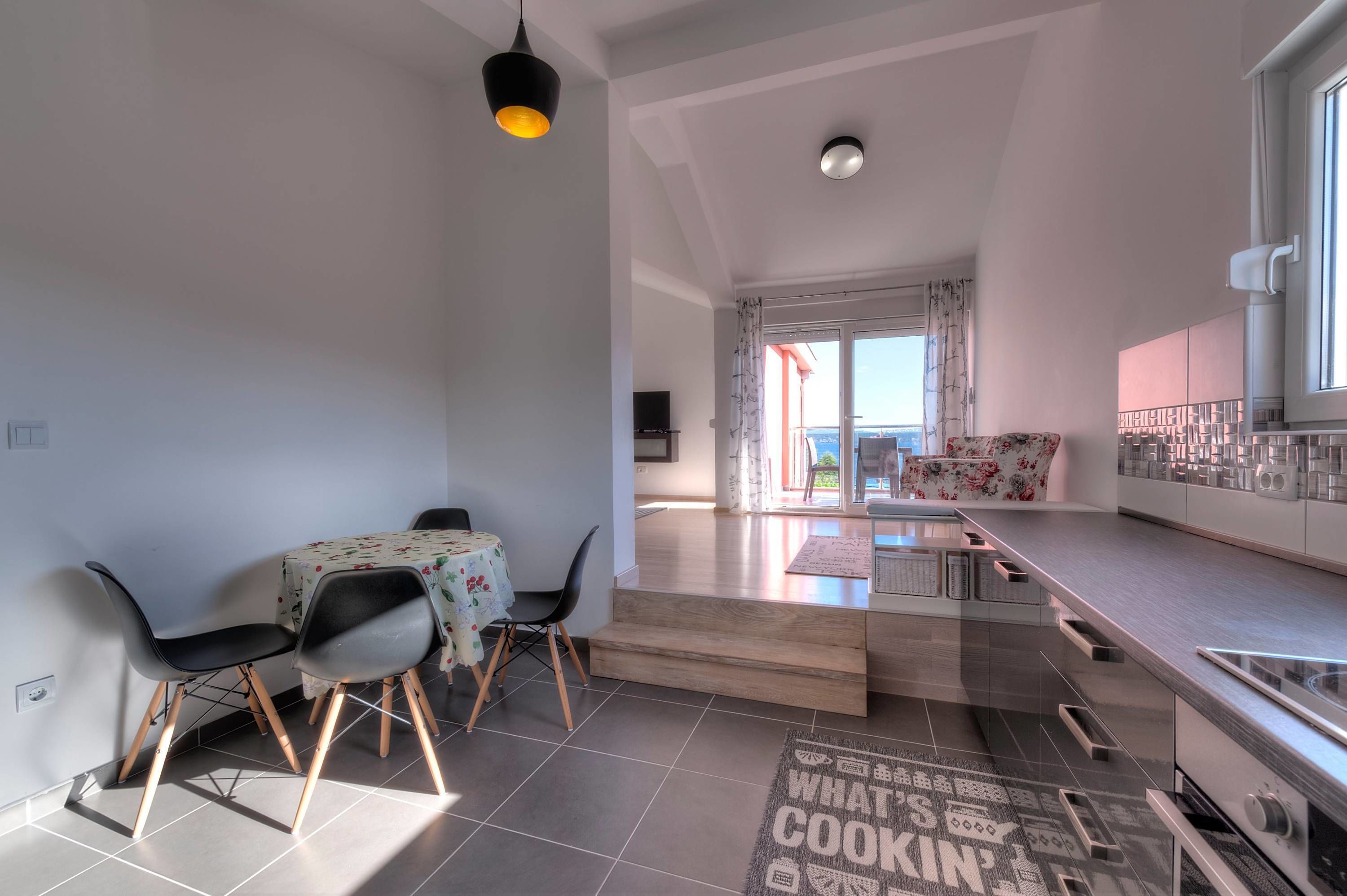 Deluxe Apartment, 1 Bedroom, Sea View | Living area | Flat-screen TV, fireplace