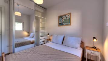 Deluxe Apartment, 1 Bedroom, Sea View | 1 bedroom, desk, soundproofing, iron/ironing board