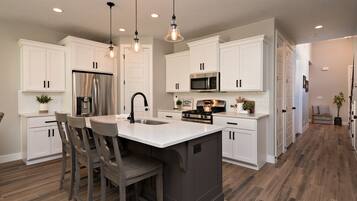 Coffee/tea maker, fridge, microwave, oven