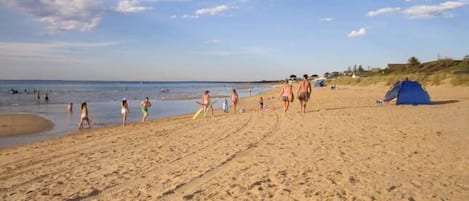 On the beach, sun-loungers
