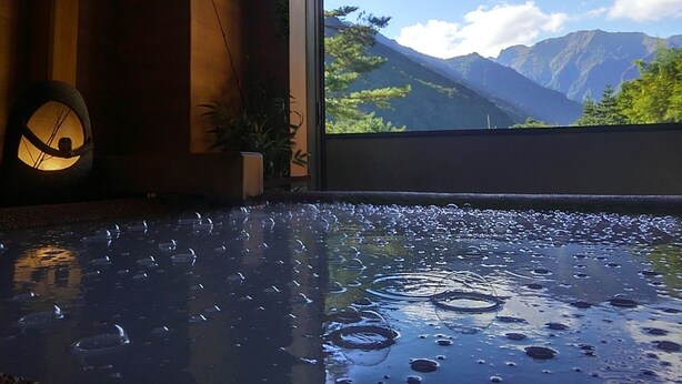 A room with a large window overlooking a mountainous landscape. - Yado Kanzan (Minakami)