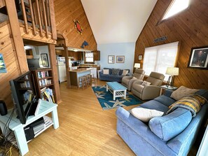 Flat-screen TV, DVD player, books