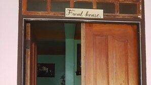 A wooden door with a sign that reads "Front House." - Desiree's Lodge And Transient House, Baler Aurora (Baler)