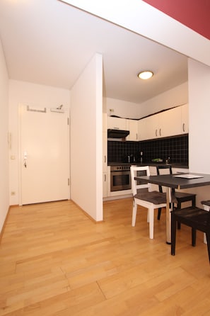 Enjoy cooking in the kitchen with an oven and stovetop, then dine in the adjacent dining area.