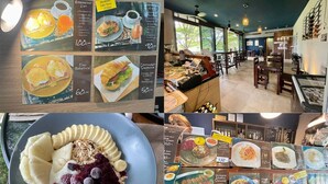 A restaurant with breakfast menu options, including items like Eggs Benedict and Croissant Sandwich. - Unixx South Pattaya by GrandisVillas (Pattaya)
