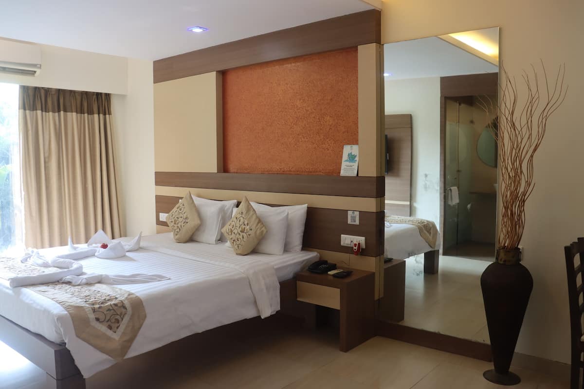 Junior Pool View Suite | 1 bedroom, premium bedding, in-room safe, desk