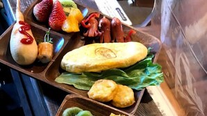 A variety of food items displayed on wooden trays. - Yado Poppoya (Tsuru)