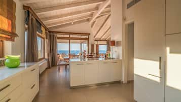 Deluxe Apartment, Sea View | Private kitchen | Full-size fridge, microwave, oven, stovetop