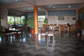 Breakfast, lunch, dinner served; local cuisine 