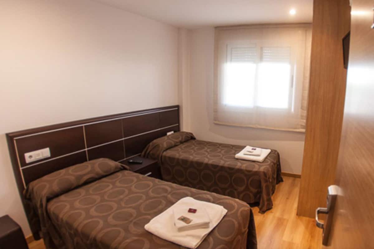Blackout curtains, soundproofing, free WiFi, bed sheets