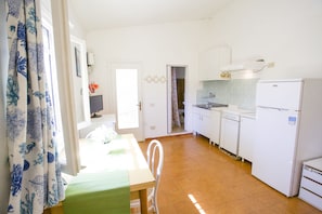 Apartment | Private kitchen | Fridge, stovetop, cookware/dishes/utensils