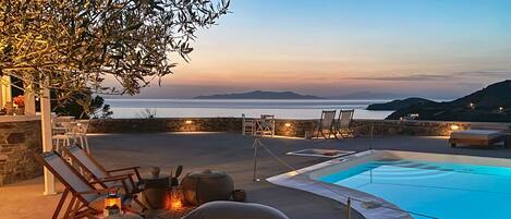 Outdoor pool, open 9 AM to 8 PM, pool umbrellas, pool loungers